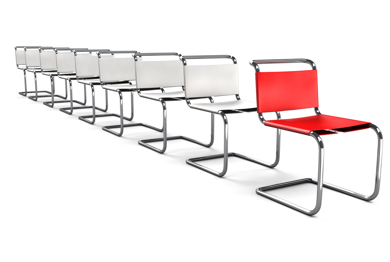 Modern Office Chairs in a line with the Red one Standing Out in the Front.The Office Chair Concept series