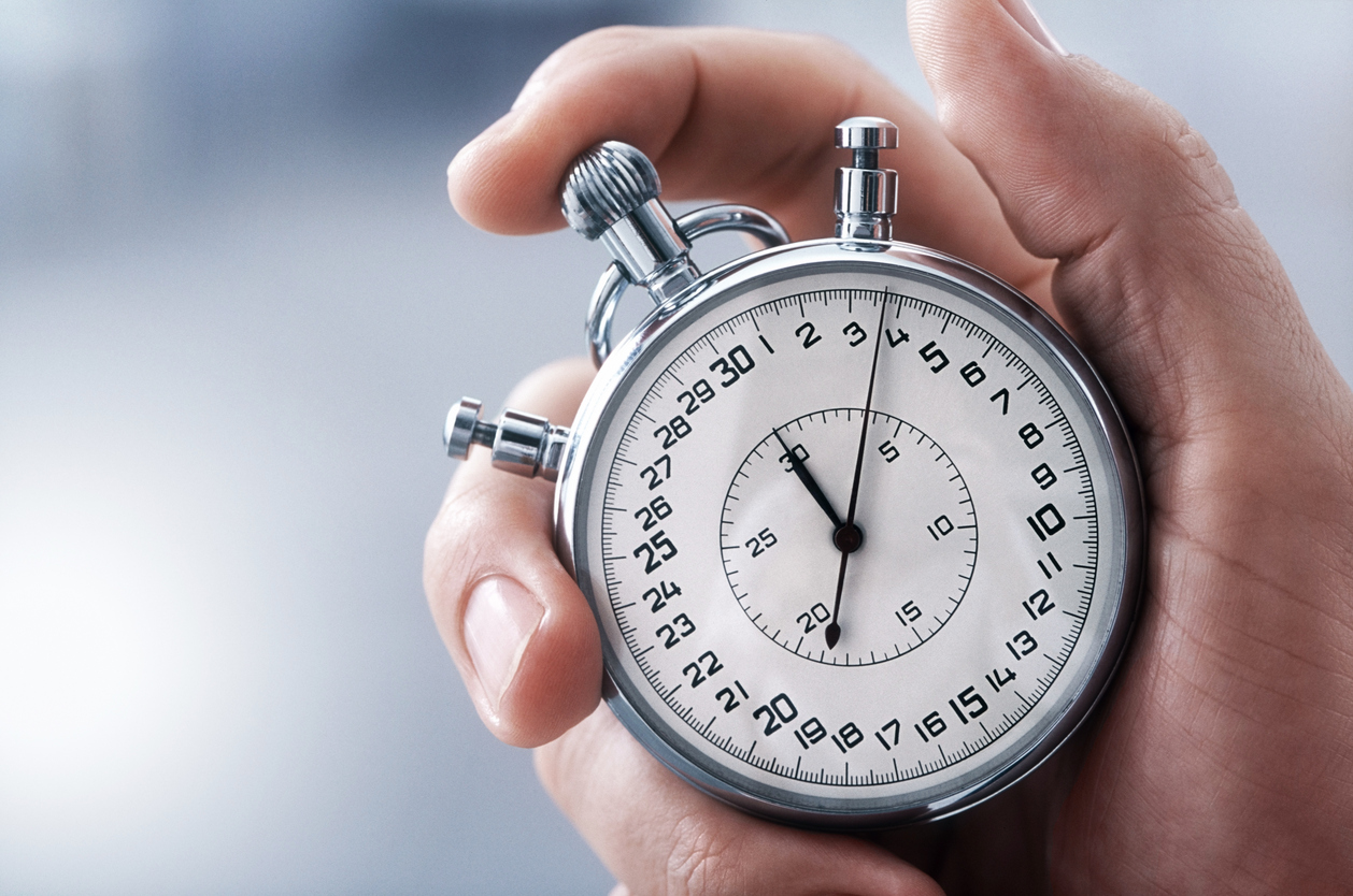 Hand with classic stopwatch